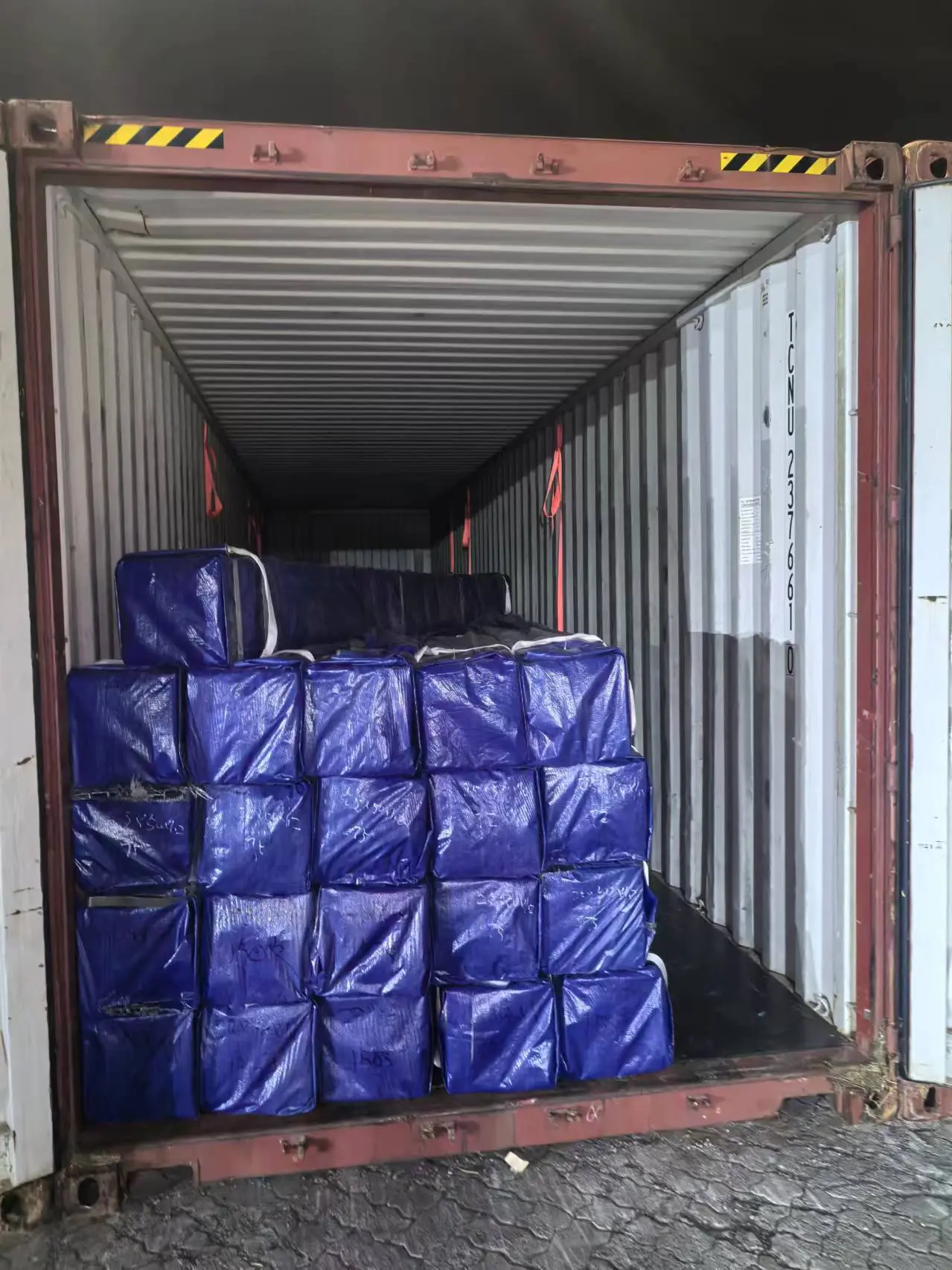 Export containers being filled with square and rectangular steel tube at the shipping bay