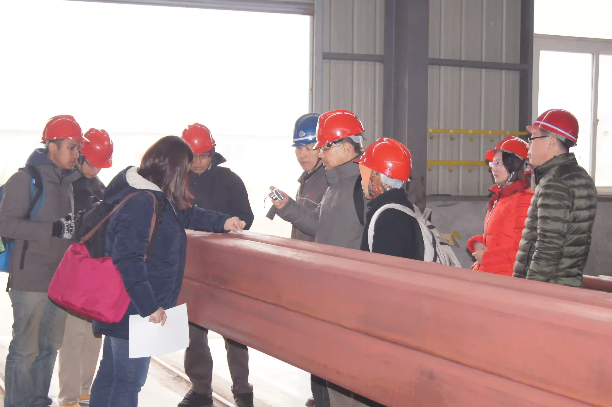 International client inspecting steel tube goods before shipment