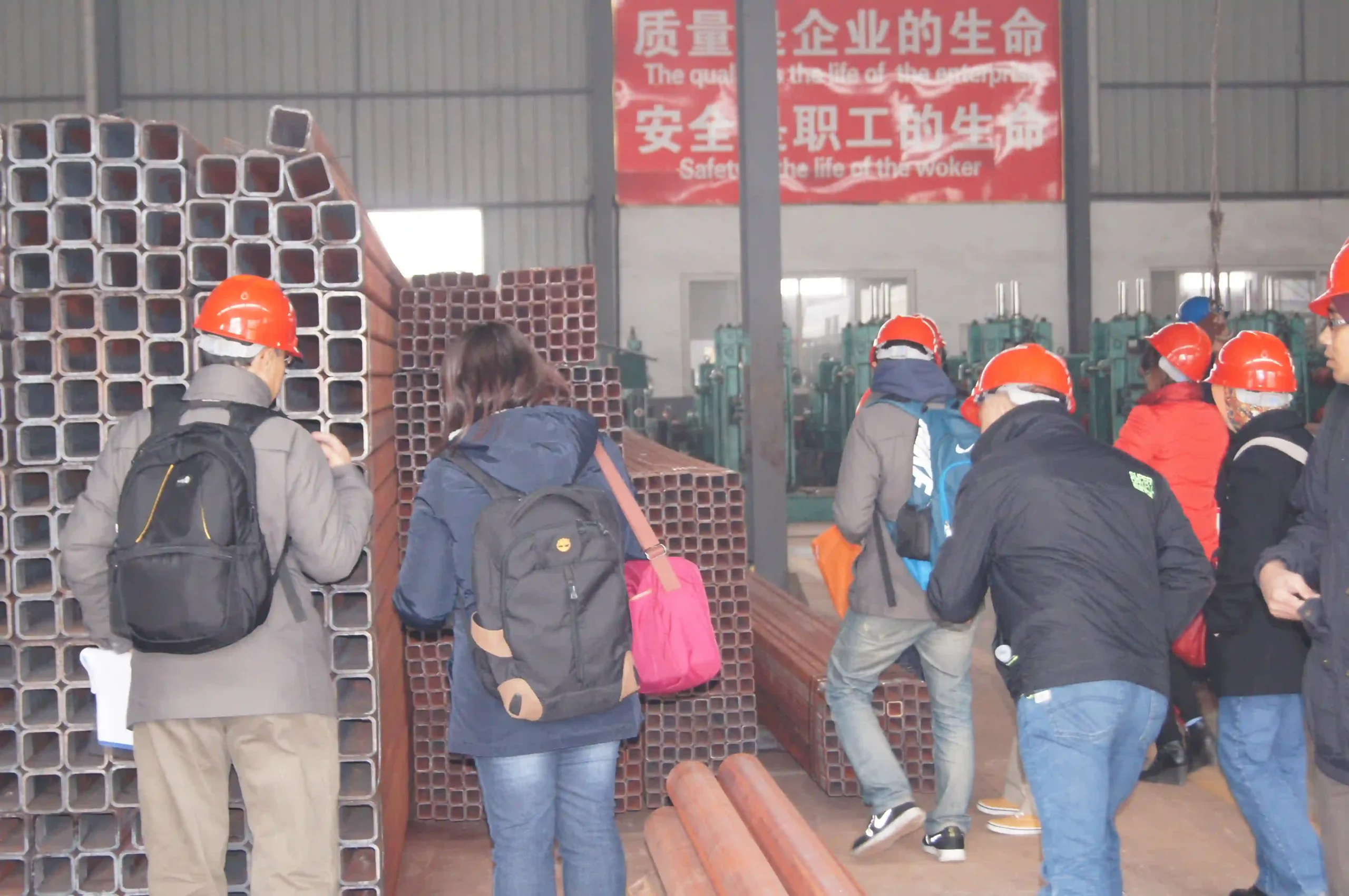 Group photo of overseas partners at the SD XJY Pipe factory