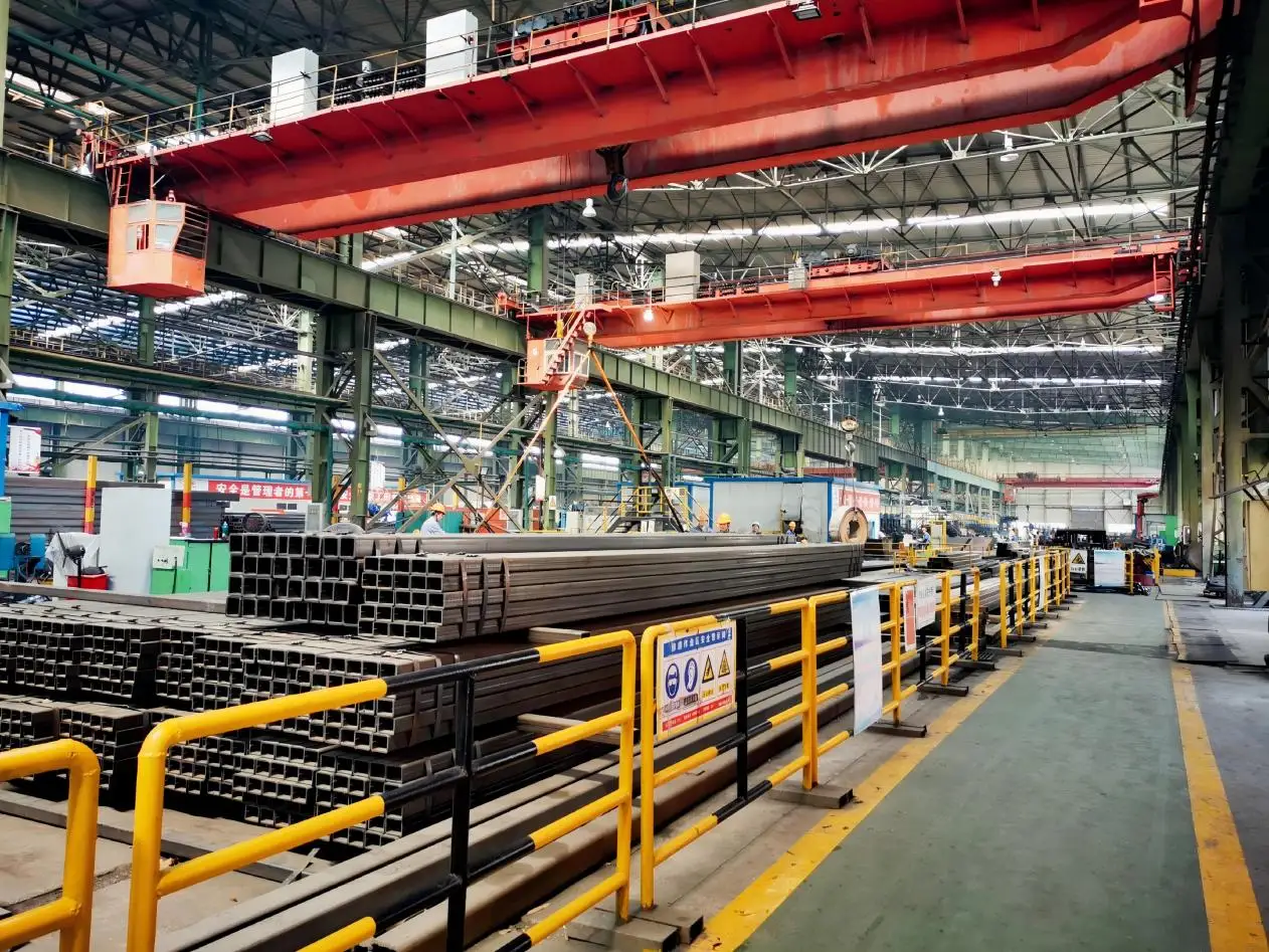 Steel tube manufacturing shop with forming and welding equipment
