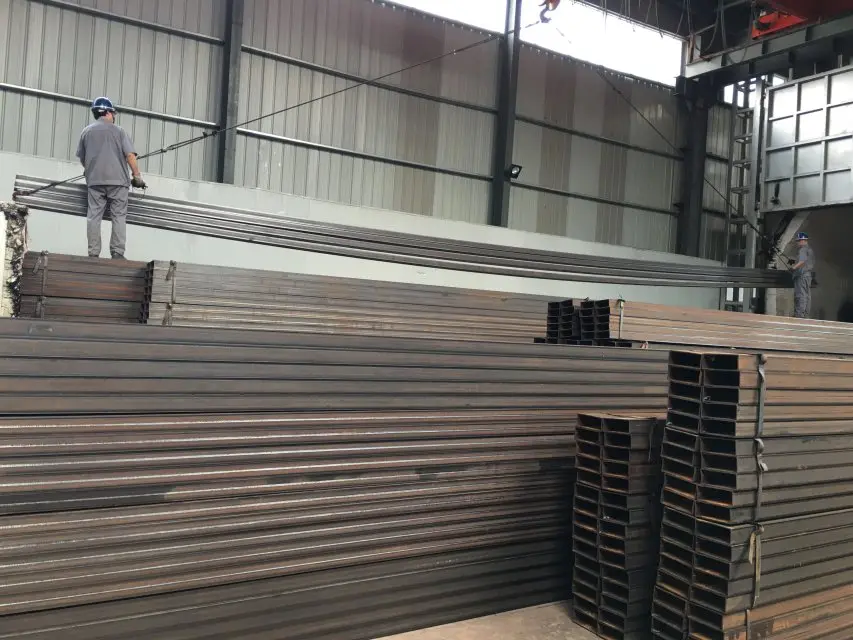 Operator monitoring the heavy-wall steel tube production line